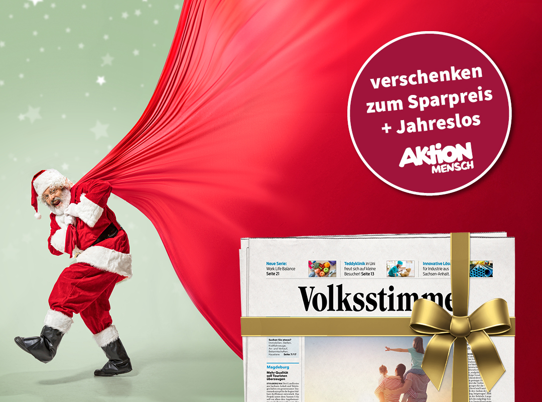 Weihnachtsmann und Zeitung mit Schleife